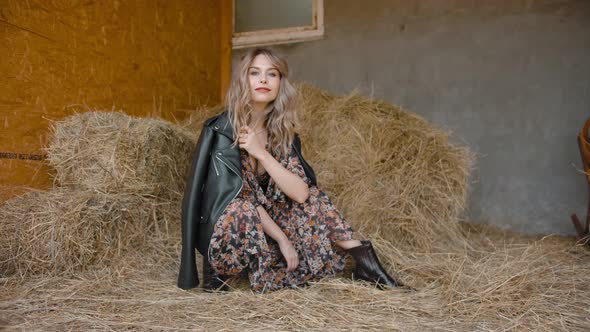 Flirty Female Near Heap of Hay