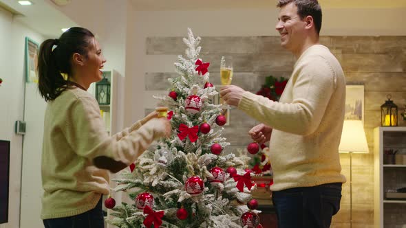 Beautiful Young Couple Drinking Champagne