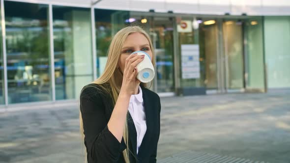 Business Woman Speaking on Phone and Waving with Hand. Elegant Modern Young Lady Sitting on Bench