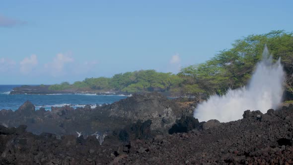 Waves crashing into shore on Hawaii