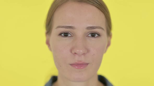 Face Close Up of Serious Young Woman Looking at Camera