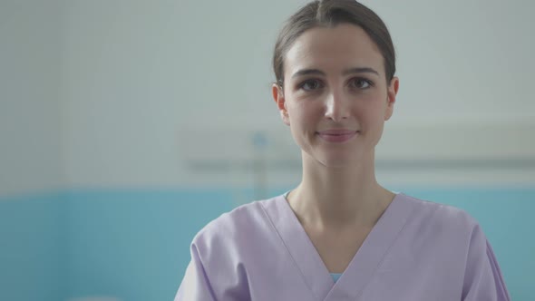 Professional young nurse smiling and posing at the hospital