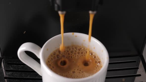 Making Espresso with Coffee Machine in White Cup