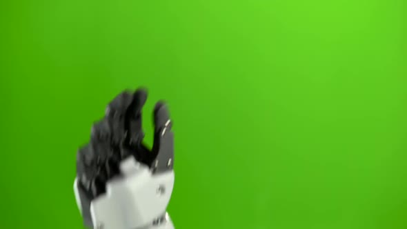 Hand of a Robot Close Up Waving Goodbye. Green Screen