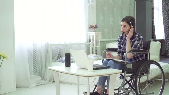 Young Woman Disabled Wheelchair Remote Work at Home Computer Headset