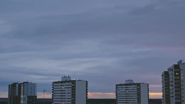 Evening Timelapse of the Sleeping Area of the City with High Apartment Complexes the Night Falls