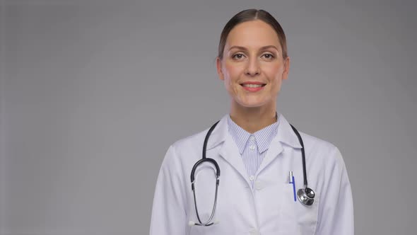 Happy Smiling Female Doctor with Stethoscope