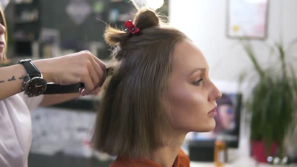 Side View Footage of a Beautiful Young Woman with a Casual Make Up in Beauty Salon