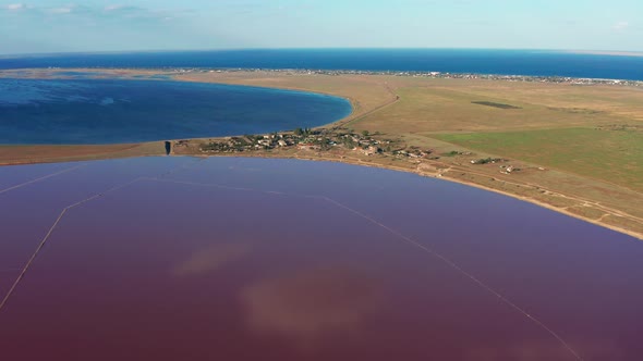 Beautiful top view of the salty, pink lake. Beautiful pink sunset.