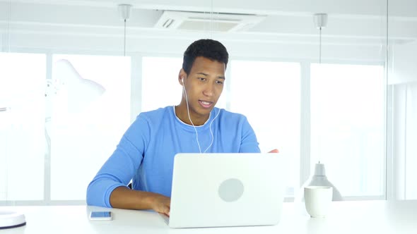 Man Busy Online Video Chat on Laptop at Work