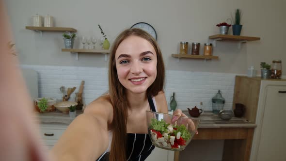 POV Shot of Blogger Girl Making Photos, Taking Selfies with Salad for Social Media on Mobile Phone