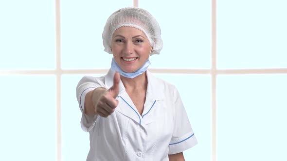 Happy Woman Doctor Giving Thumb Up Sign