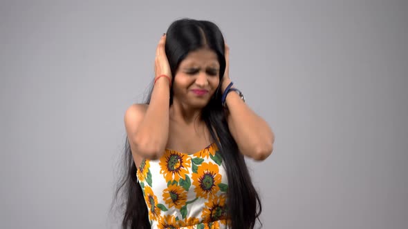 Angry Indian girl closses her ears