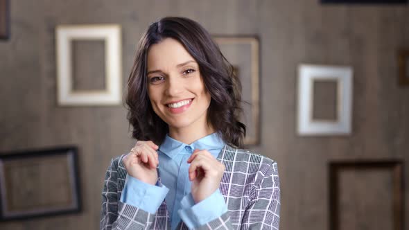 Charming Young Businesswoman Having Positive Emotion Posing at Studio Background