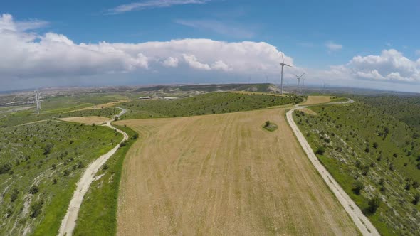 Peaceful Windmill Farm Located on Meadow Supplying Renewable Energy to Cities