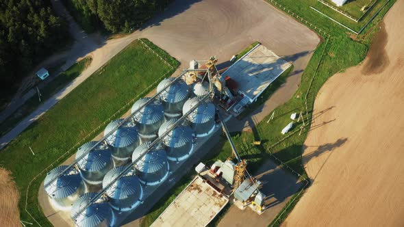 Aerial Elevated Top View Modern Granary Graindrying Complex Commercial Grain Or Seed Silos In Sunny