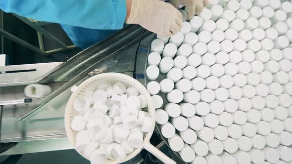 Top View of Pill Tubs Getting Put Onto the Conveyor