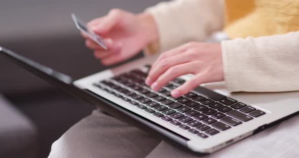 Woman use of laptop computer for online shopping with credit card