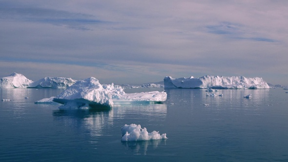 Greenland. Sailing Among Awesome Icebergs, Disko Bay. Lifestyle. Boat sailing among icebergs.