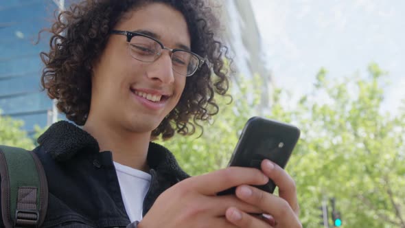 Man using mobile phone on city street 4k