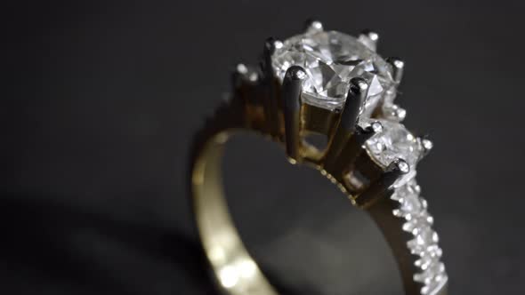 Extreme Detailed of Diamond Ring Close Up Shot While Rotating on Dark Background