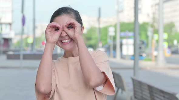 Indian Woman Searching with Handmade Binocular