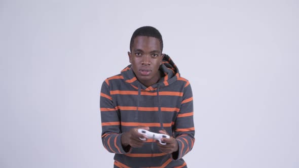 Young Stressed African Man Playing Games and Losing