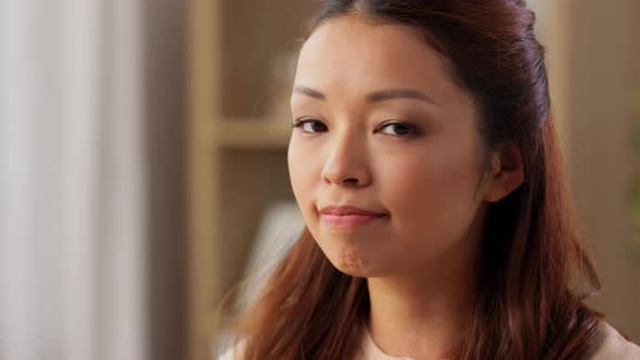 Portrait of Happy Smiling Asian Young Woman