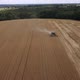 Flying above wheat field. Combine harvesting. Agricultural machine working - VideoHive Item for Sale