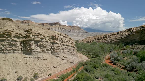 Aerial view flying over desert rock layers in Caineville Utah