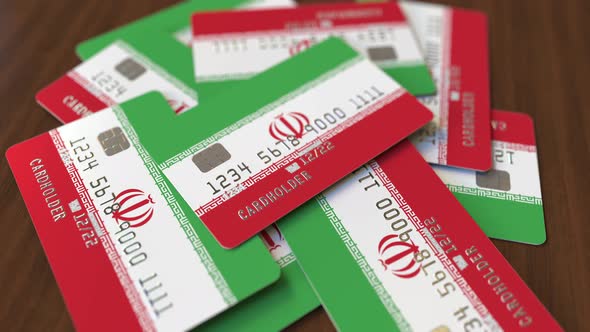 Pile of Credit Cards with Flag of Iran alt