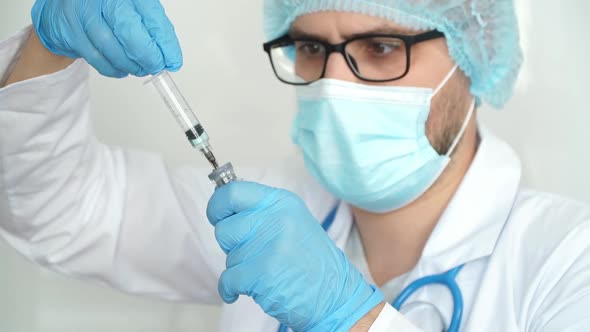 Doctor Fills Syringe with Drug