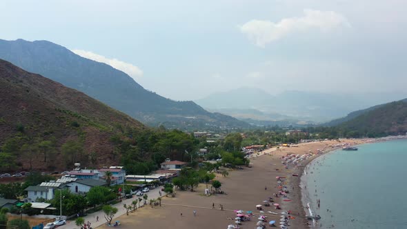 aerial view of a dry mountainous beach town along the Mediterranean coastline of Adrasan Beach in Tu