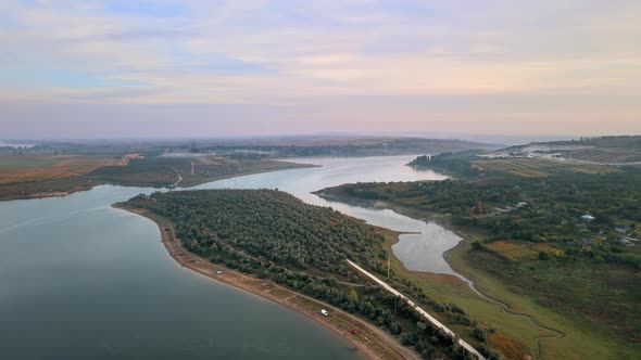 Aerial drone view of the Duruitoarea natural reservation in Moldova. River and fog in the air, hills