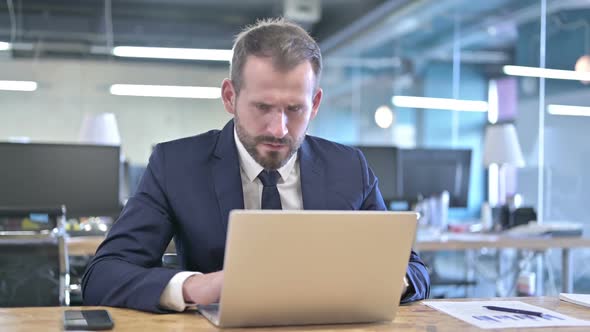 Shocked Young Businessman Getting Upset in Office