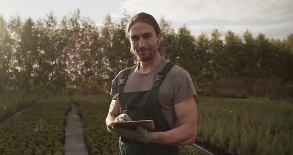 Male Farmer with Tablet in Field