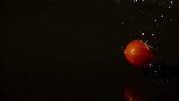 Tomato falling and spinning on a wet surface, Ultra Slow Motion