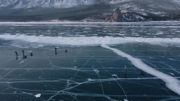 Aerial View of Man Skating on Lake Baikal Covered By Ice