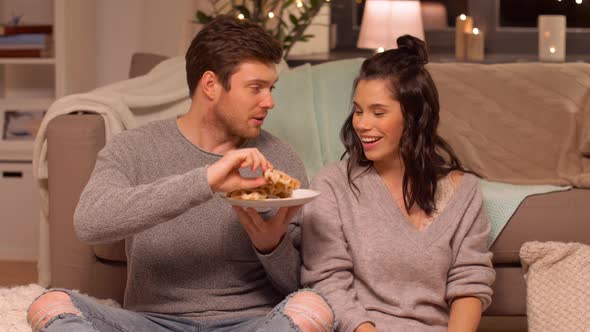 Couple Eating Waffles with Hot Chocolate at Home