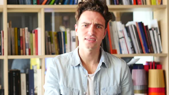 Frustrated Angry Man Yelling, Sitting in Office