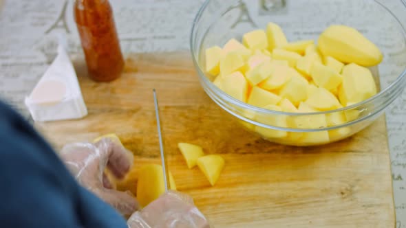 The Chef Cuts the Potatoes with a Professional Knife