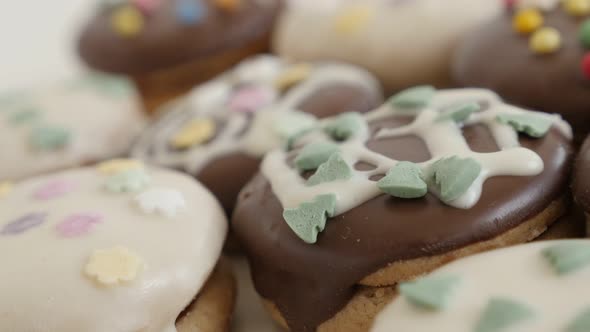 Mixed teacakes stuffed with marmalade on pile 4K 2160p 30fps UltraHD footage - Panning over tasty lo