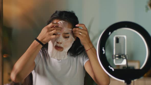 Beauty Blogger Applying Sheet Mask