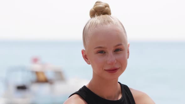 Young Blonde Woman By the Sea