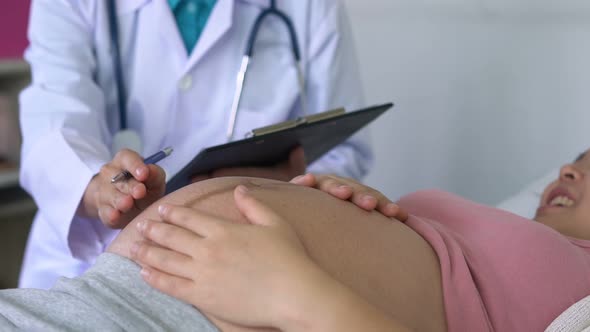 Pregnant Woman and Gynecologist Doctor at Hospital