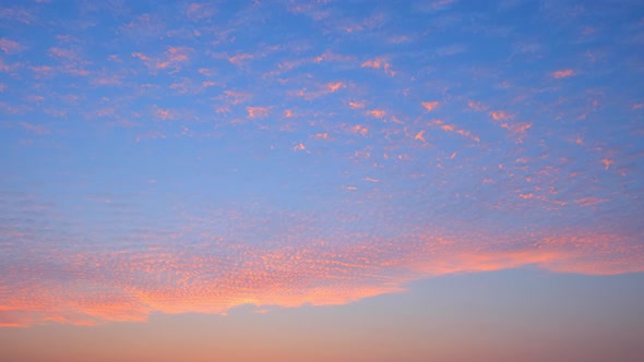 4K UHD : Time lapse of colorful sky during beautiful sunset. Romantic clouds.