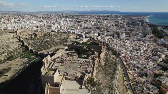 Drone Flying backwards over Monumental Complex of Alcabaza of Almería, Andalusia. Spain