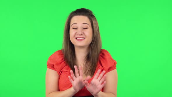 Portrait of Cute Girl Strictly Gesturing with Hands Shape Meaning Denial Saying NO. Green Screen