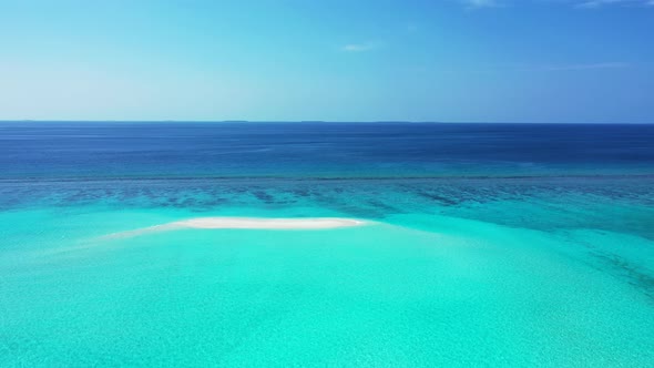 Beautiful drone clean view of a sandy white paradise beach and aqua turquoise water background in vi