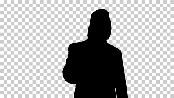 Silhouette Businessman talking on mobile phone happily